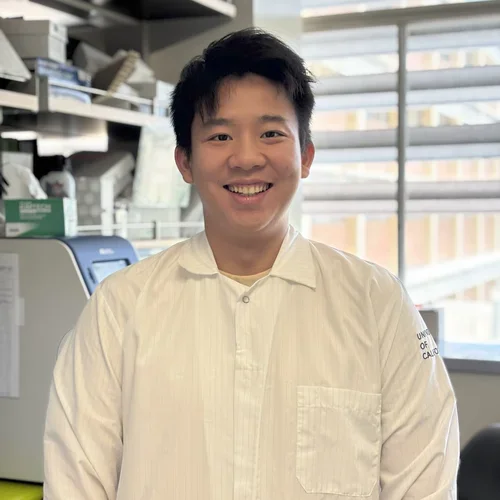 Phoenix is standing in the lab next to qPCR machine